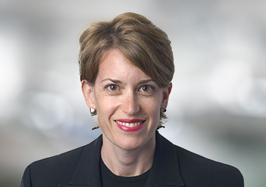 Aerial view of a courthouse with solar panels on the roof, symbolizing sustainable justice